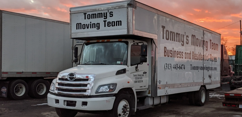 Tommy's Moving Team Company logo